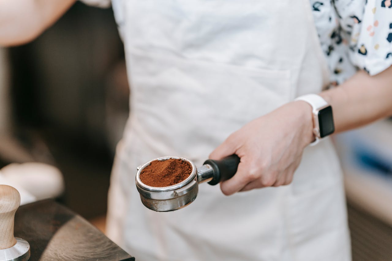 A Barista Holding a Portafilter